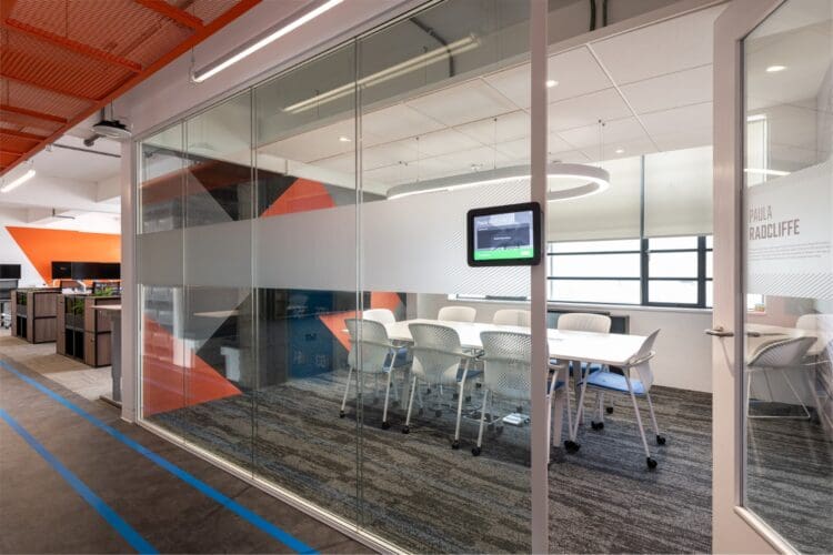 Glazed fronted meeting room with manifestation.