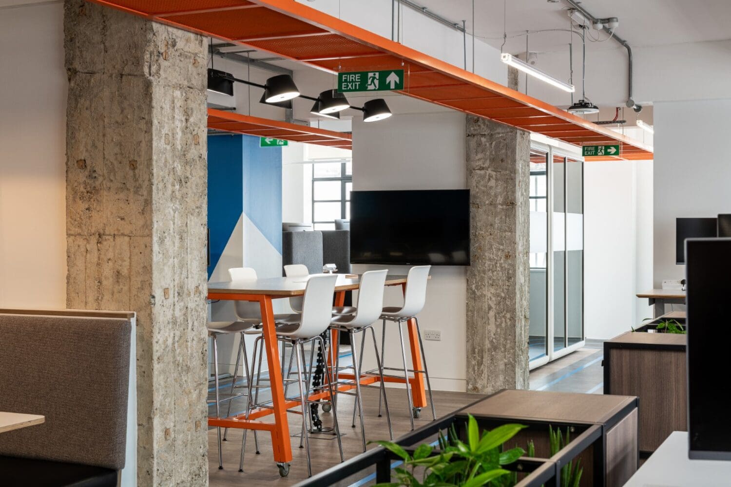 Industrial features in branded office refurbishment.