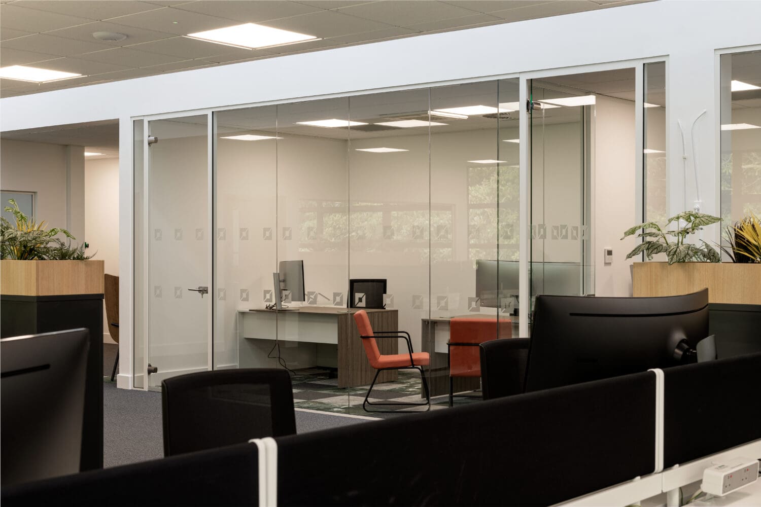 Modern office interior design with glazed meeting room.
