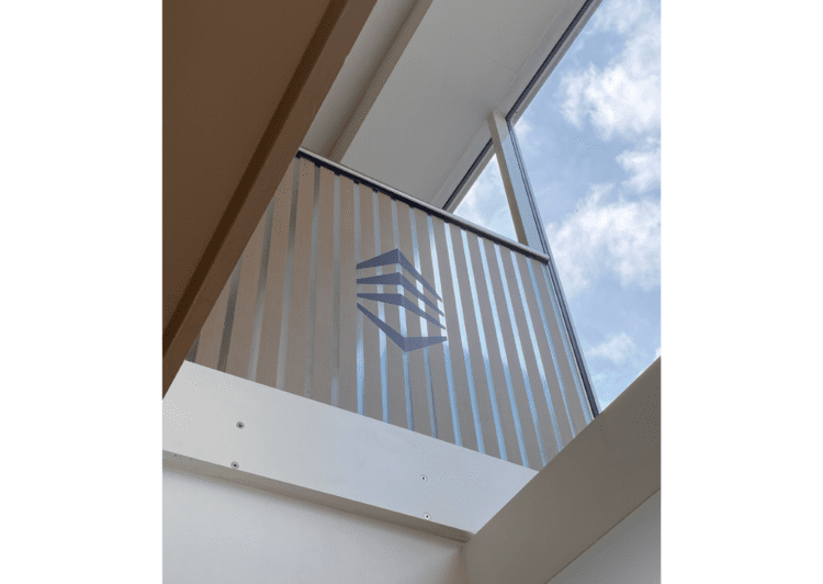 Glass balustrade with branded logo and wood slat manifestation.