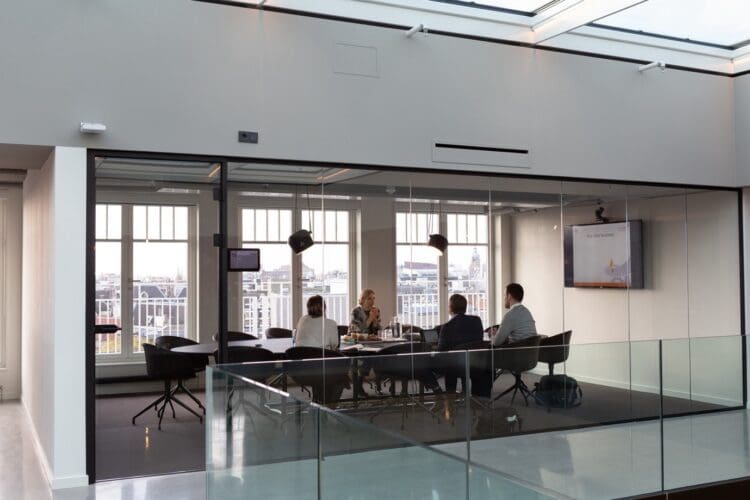 Glazed fronted boardroom with modern office furniture solutions.