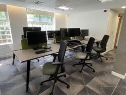 Modern office interior design scheme with task chairs in green finishes.