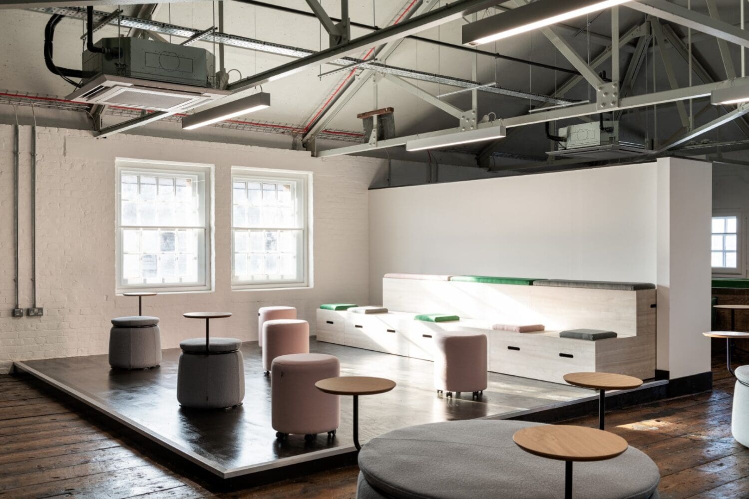 Bleacher seating breakout space in office interior design project.
