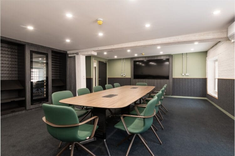 Corporate boardroom design with acoustic panels and high-end boardtable and chairs.- Office designers Rap Interiors
