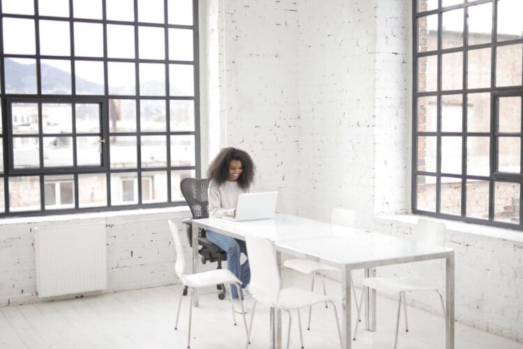 Lady working in modern industrial office deign.