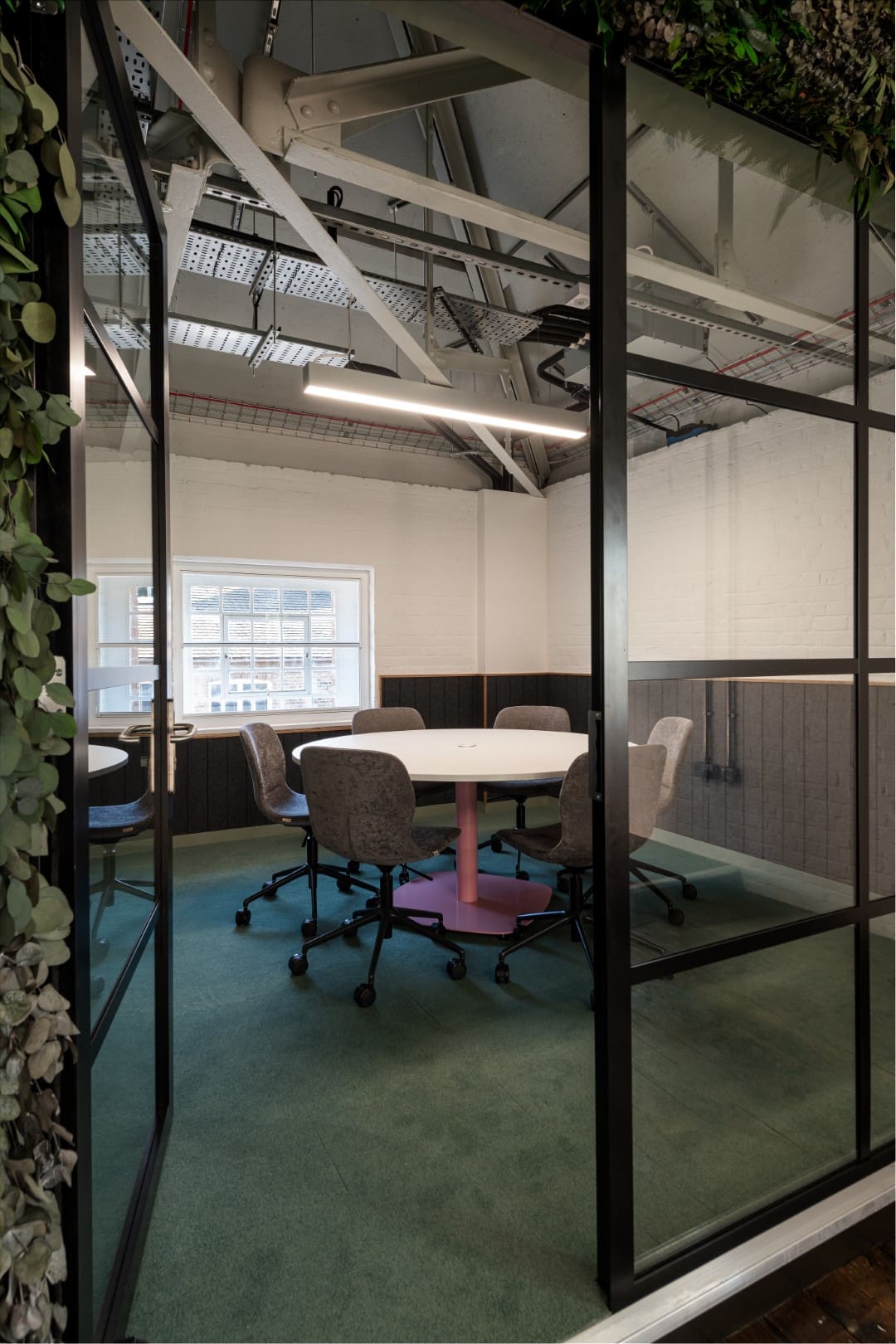 Meeting room with crittall glazed front and modern meeting furniture solutions.
