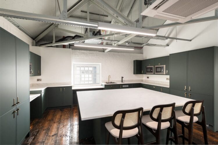 Office kitchen area design with large central island.