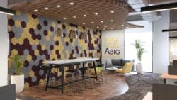 Modern office breakout space with bold feature wall design and inspirational quote.