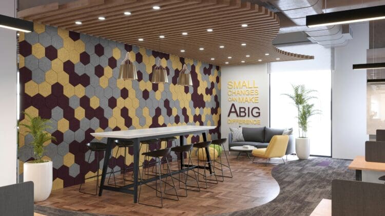 Modern office breakout space with bold feature wall design and inspirational quote.