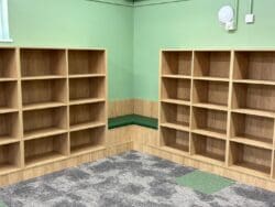 Bespoke book shelves and reading nook in school library refurbishment.