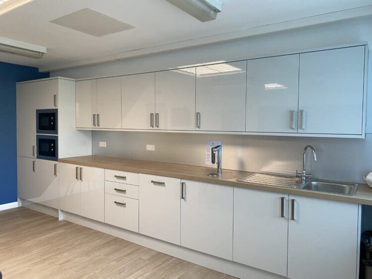 Grey gloss teapoint in modern school staffroom refurbishment.