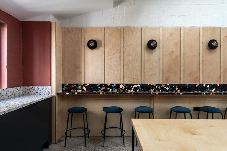 Bespoke ply wall and breakfast bar in office kitchen.