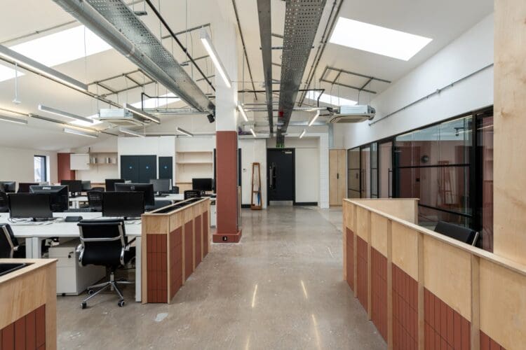 London office design and fit out with workstations and bespoke reception desk.
