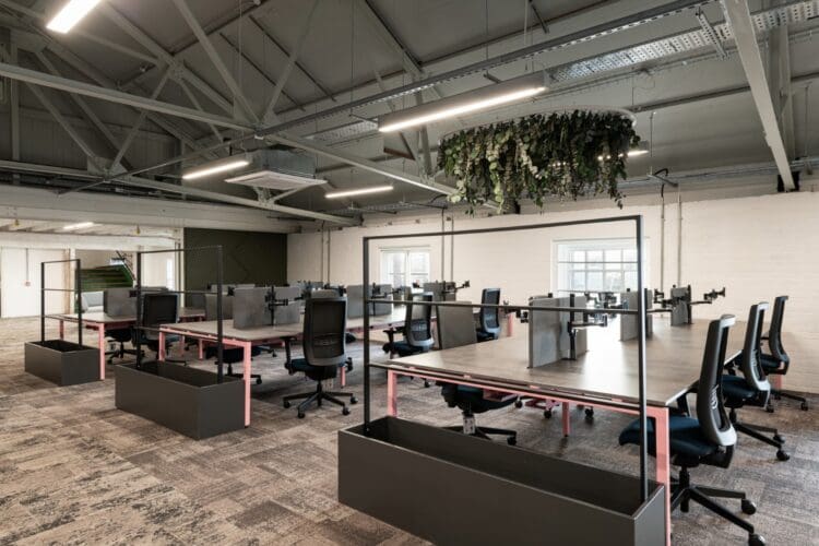 Modern office interior design project in historic building with exposed architectural features.