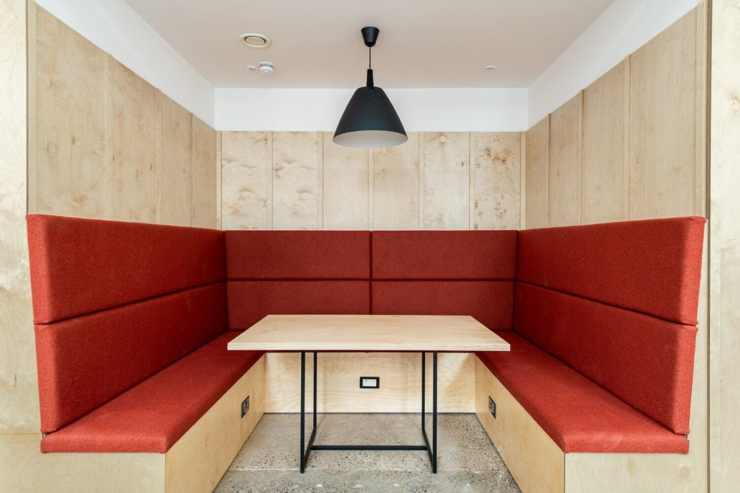 Upholstered office booth for collaboration and quiet work zone.