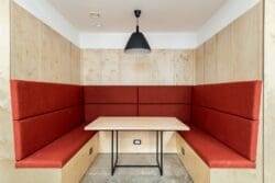 Upholstered office booth for collaboration and quiet work zone.