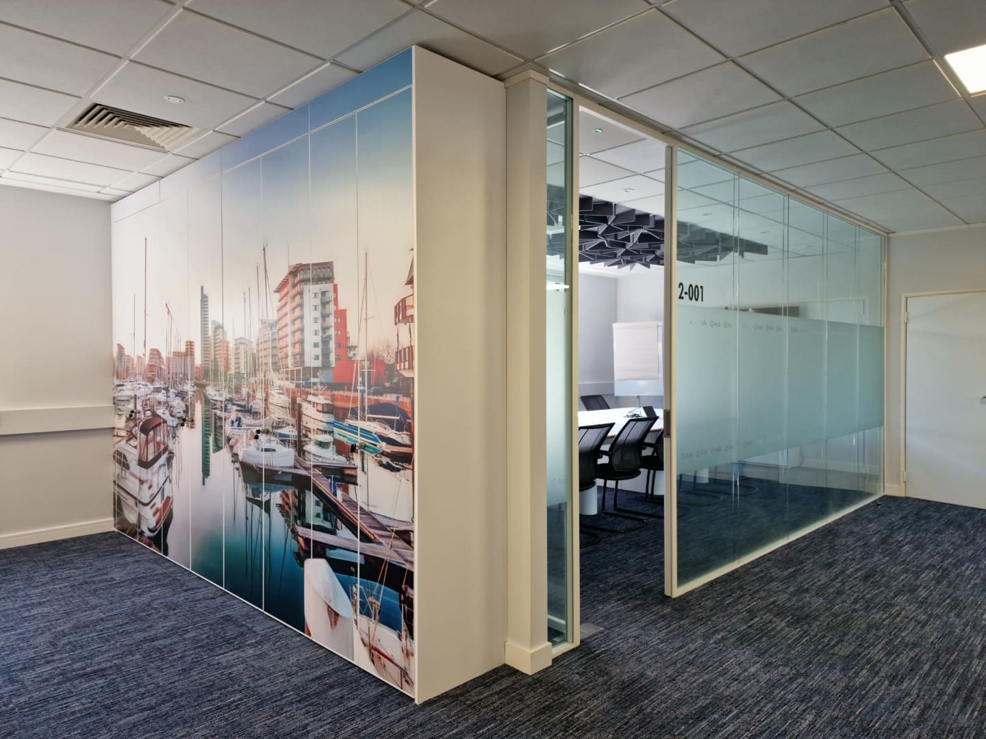 Large built in office storage cupboards with wrapped graphic.