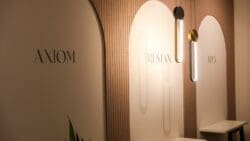 London furniture showroom design with feature wall and lighting.