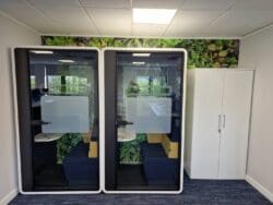 Office hybrid working pods with glass walls in office refurbishment project. Rap Interiors