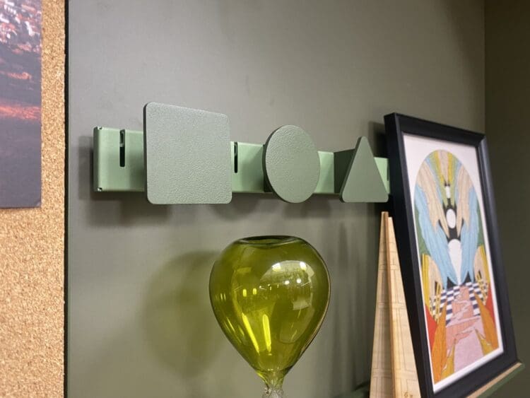 Wall hung pegs for commercial interior design and fit out projects.