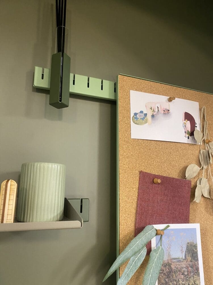 Wall mounted storage system with peg board and shelves.