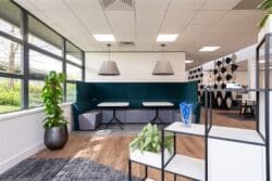 Office breakout space design with Banquet seating and feature pendant lighting. Rap Interiors