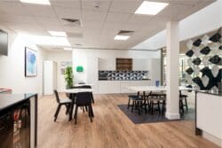 Cafe style furniture in modern office breakout space.