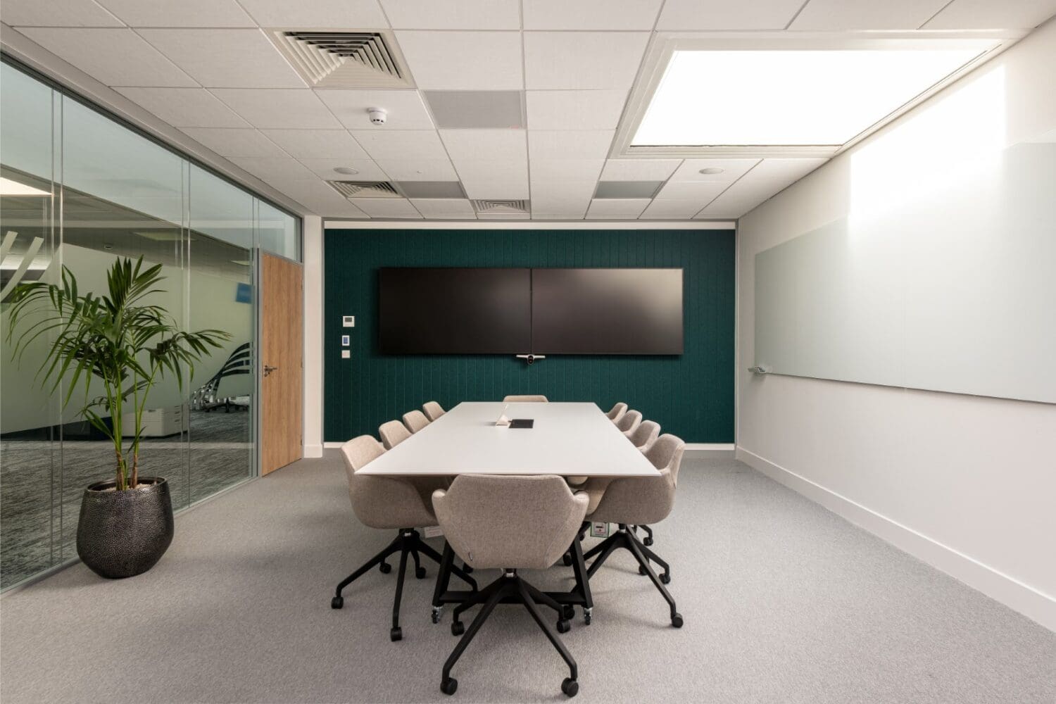 Large office boardroom with acoustic feature wall for corporate insurance company.