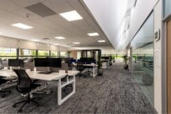 Modern office interior design scheme with height adjustable desking.