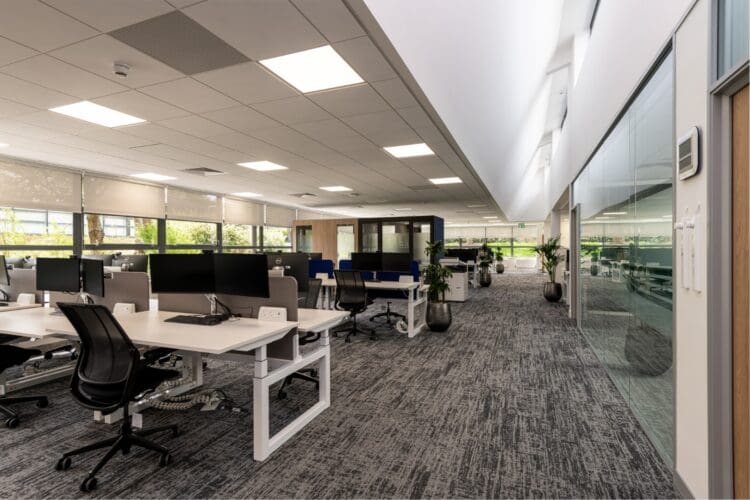 Modern office interior design scheme with height adjustable desking.