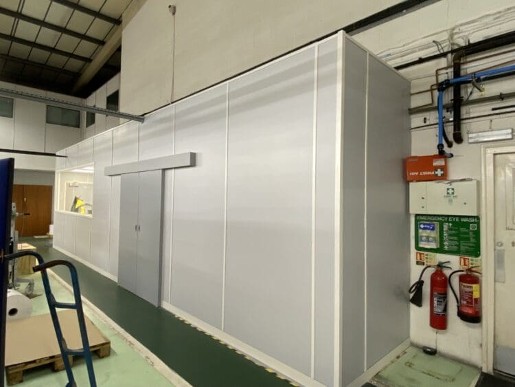 Extended warehouse office and print room with new partitions.