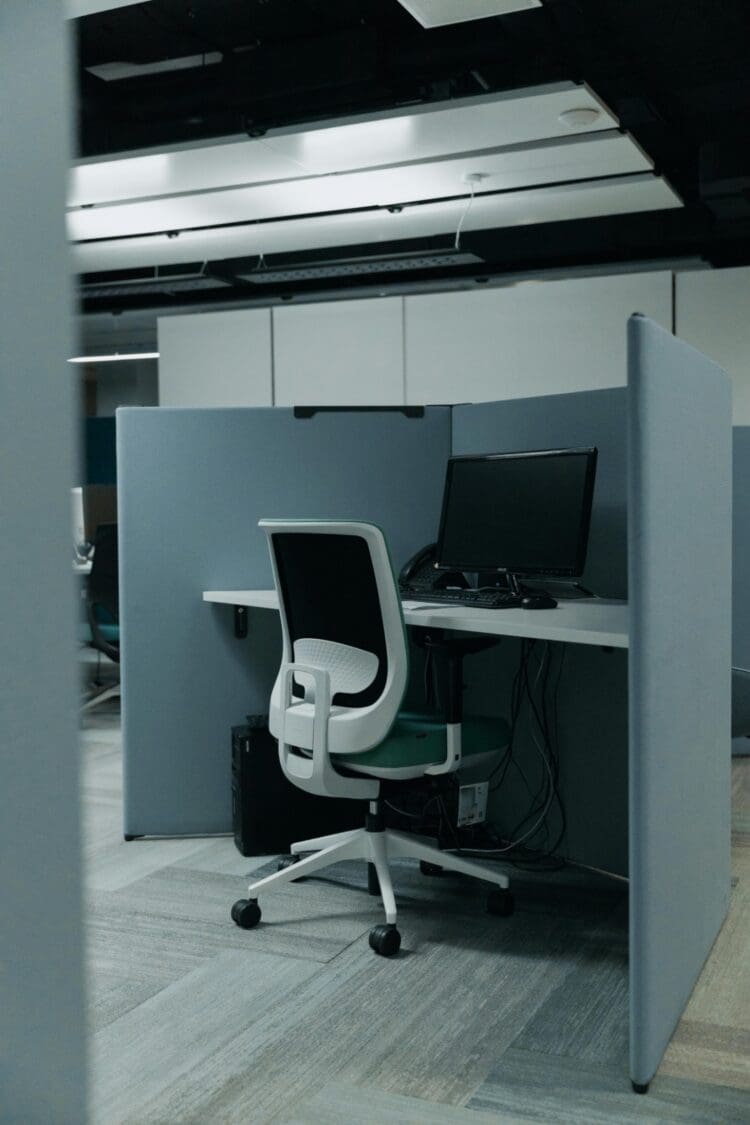 Semi private office desk in coworking office design.