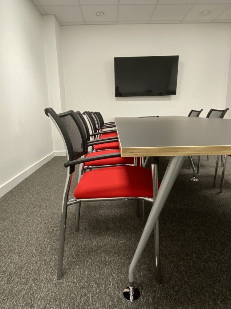 Boardroom furniture with company branded coloured upholstery.