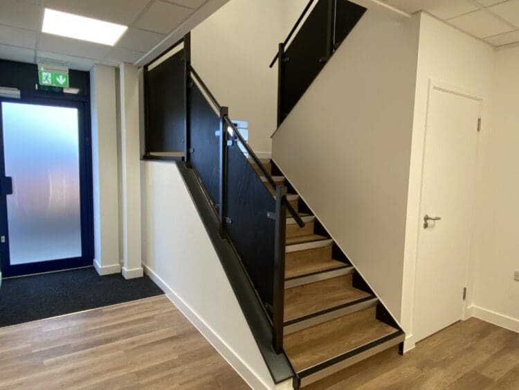 Industrial fit out project with staircase installation and mezzanine floor.