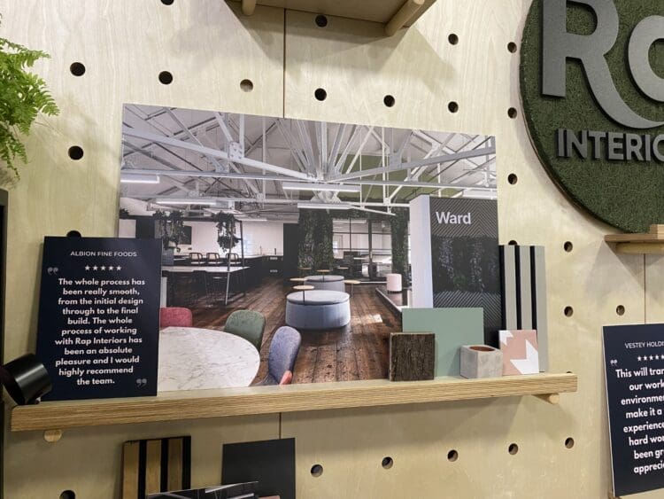 Office interior design project displayed on exhibition stand.