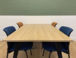 Timber effect meeting table and soft seating for London office refurbishment project.