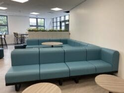 Modular seating in sixth form common room interior design.