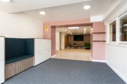 School reception area design with bespoke seating and storage.