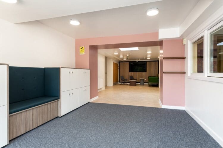 School reception area design with bespoke seating and storage.