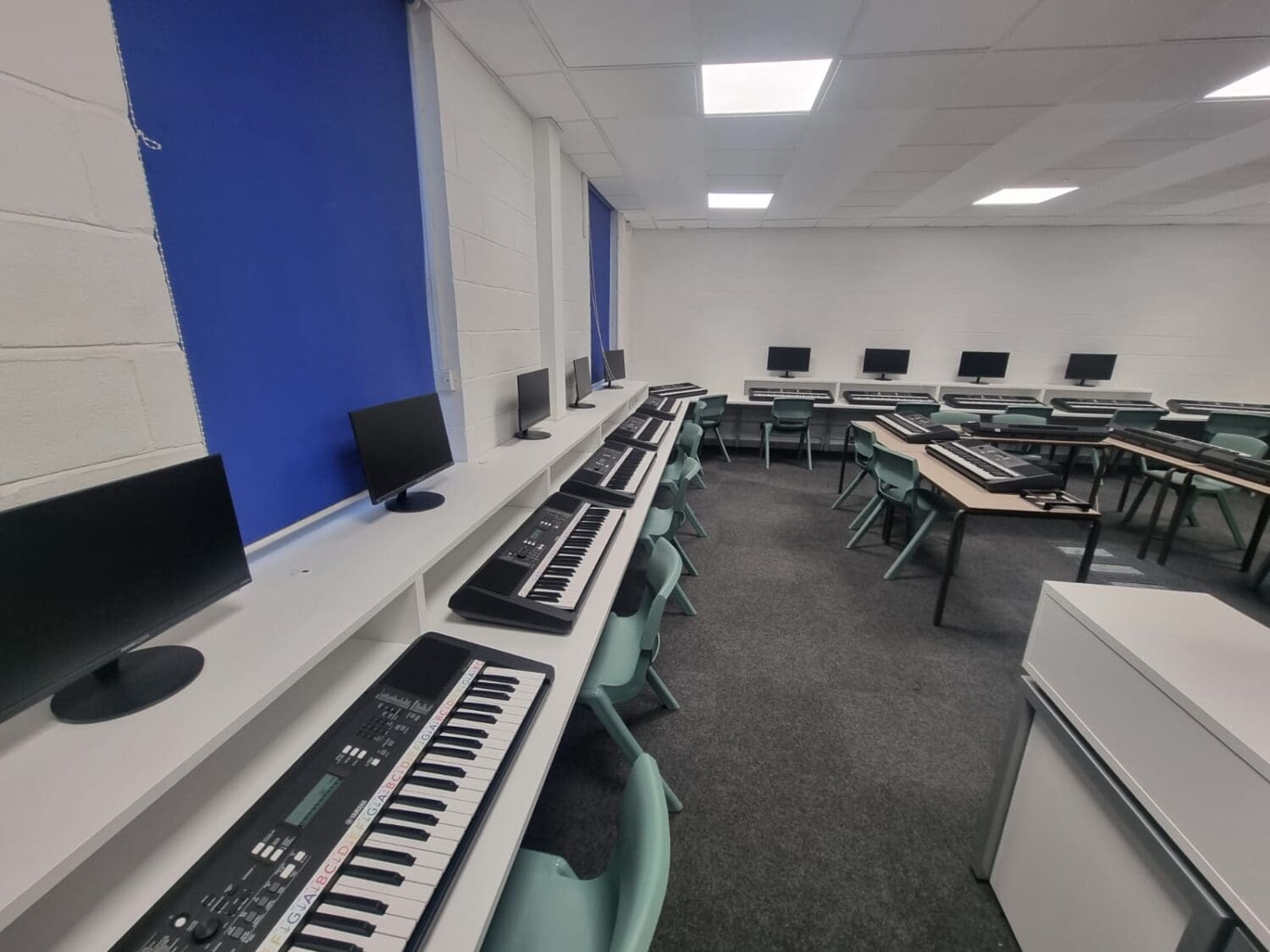 School refurbishment project transforming music technology classroom with bespoke furniture.