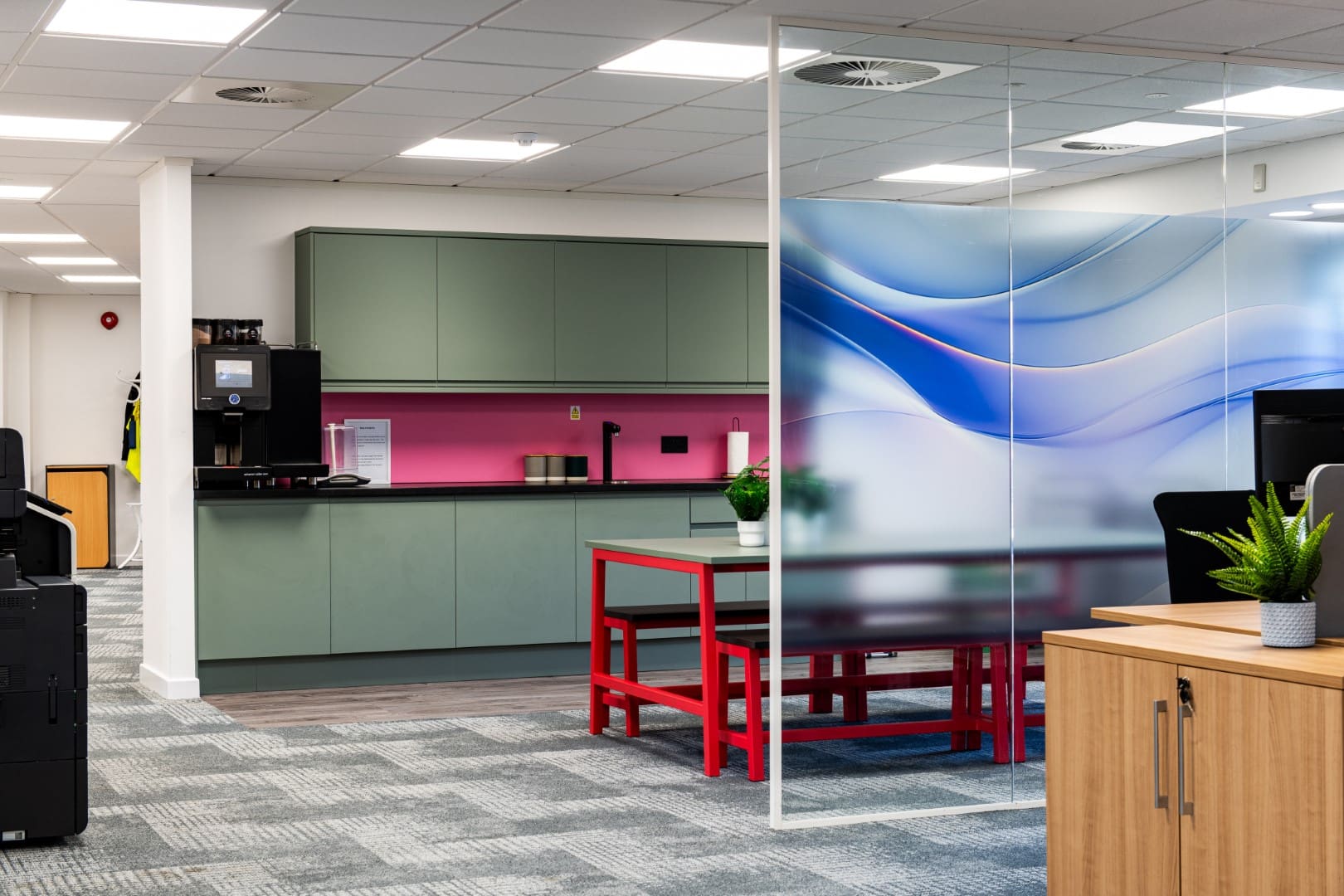 Modern office refurbishment with tea point and glass manifestation.