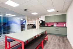 Office breakout space with modern green tea point.