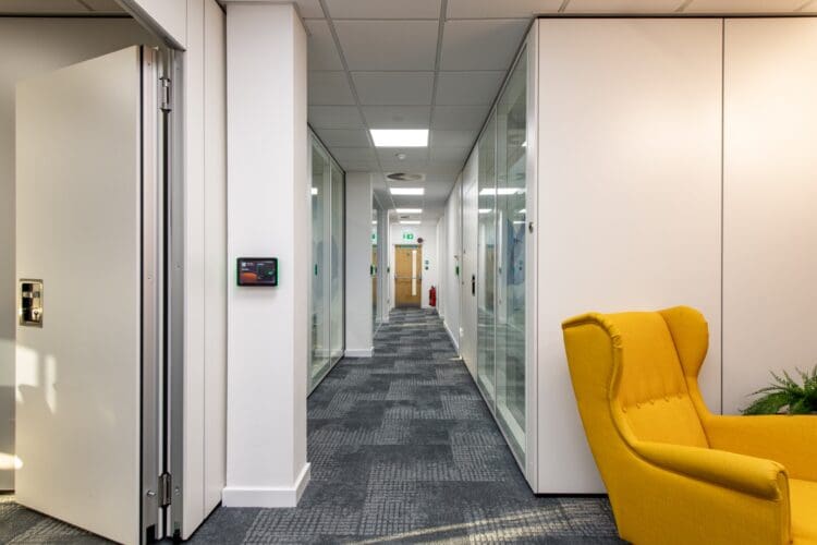 Office fit out with semi automatic operable walls creating a flexible workspace for reconfiguration.