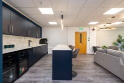 Office tea point client entertainment space with modern bar.