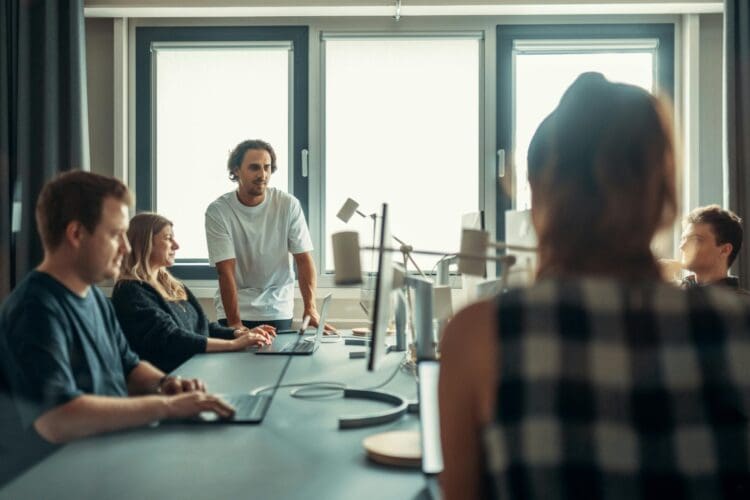 Team meeting and collaboration in modern office design.