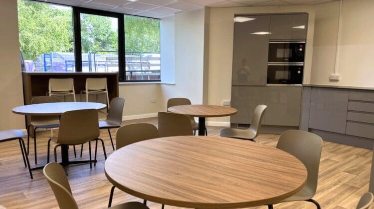 Breakout area refurbishment with dining furniture and modern tea point design.