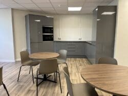 Office breakout area design with modern grey tea point.