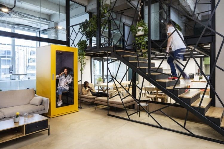 Yellow office meeting pod in modern office design.