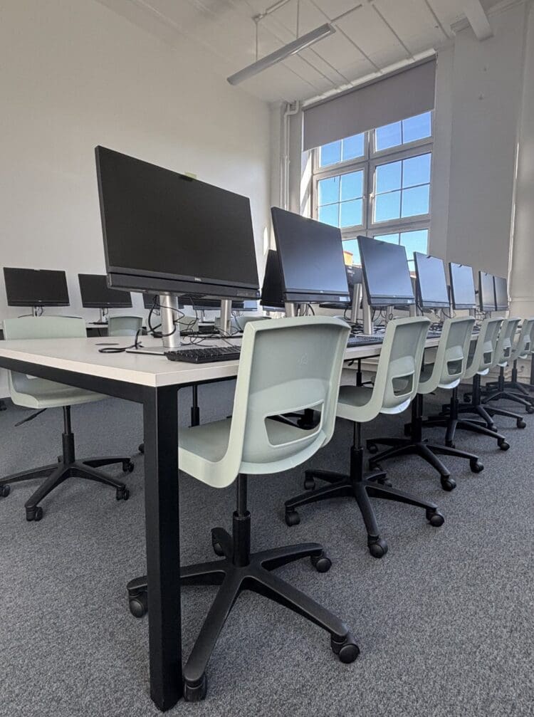 Height adjustdable chairs in modern IT suite refurbishment.