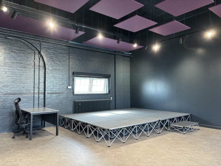 London school refurbishment transforming modern drama classroom.